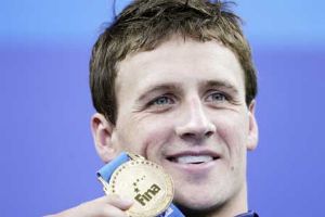Lochte claims fifth gold, matches Phelps